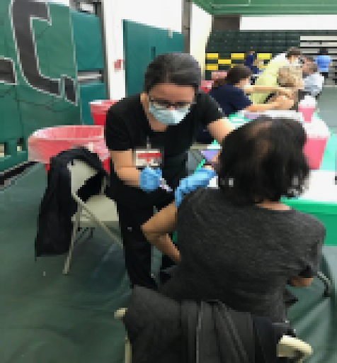 Region 4 member Aura  Velasco administering  COVD vaccines at Mercer County   Community College on March 27th, 2021